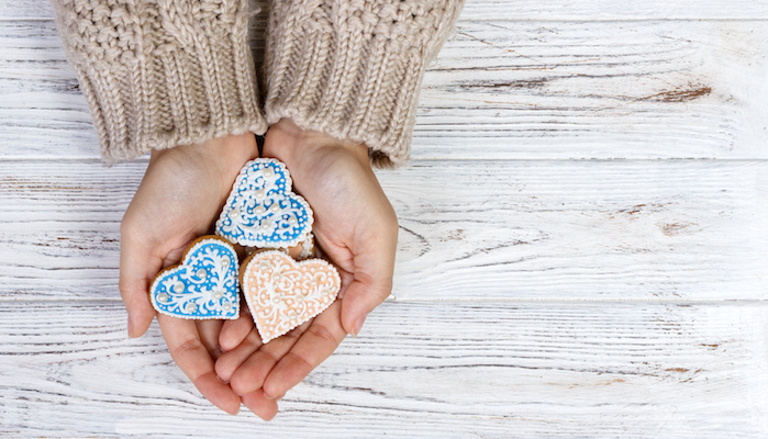 Hands Hold Cookies In Form Of Heart.